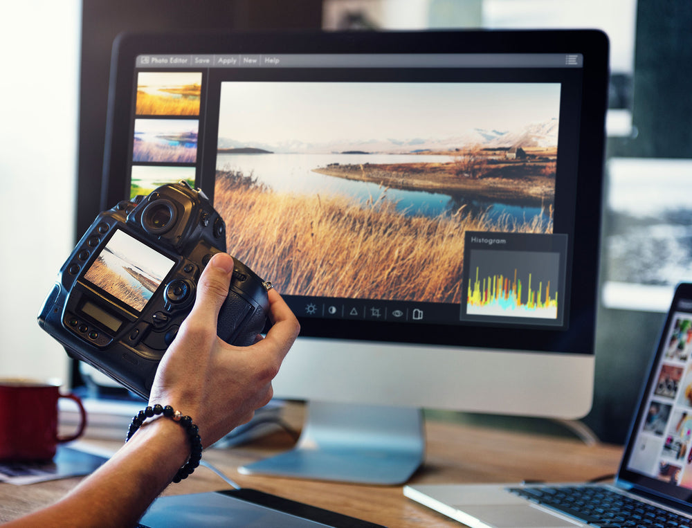 Photographer using software to edit photos